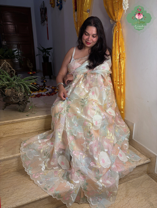 Malarika Off White Organza Silk Saree With Pastel Floral Embrodiery & Patchwork