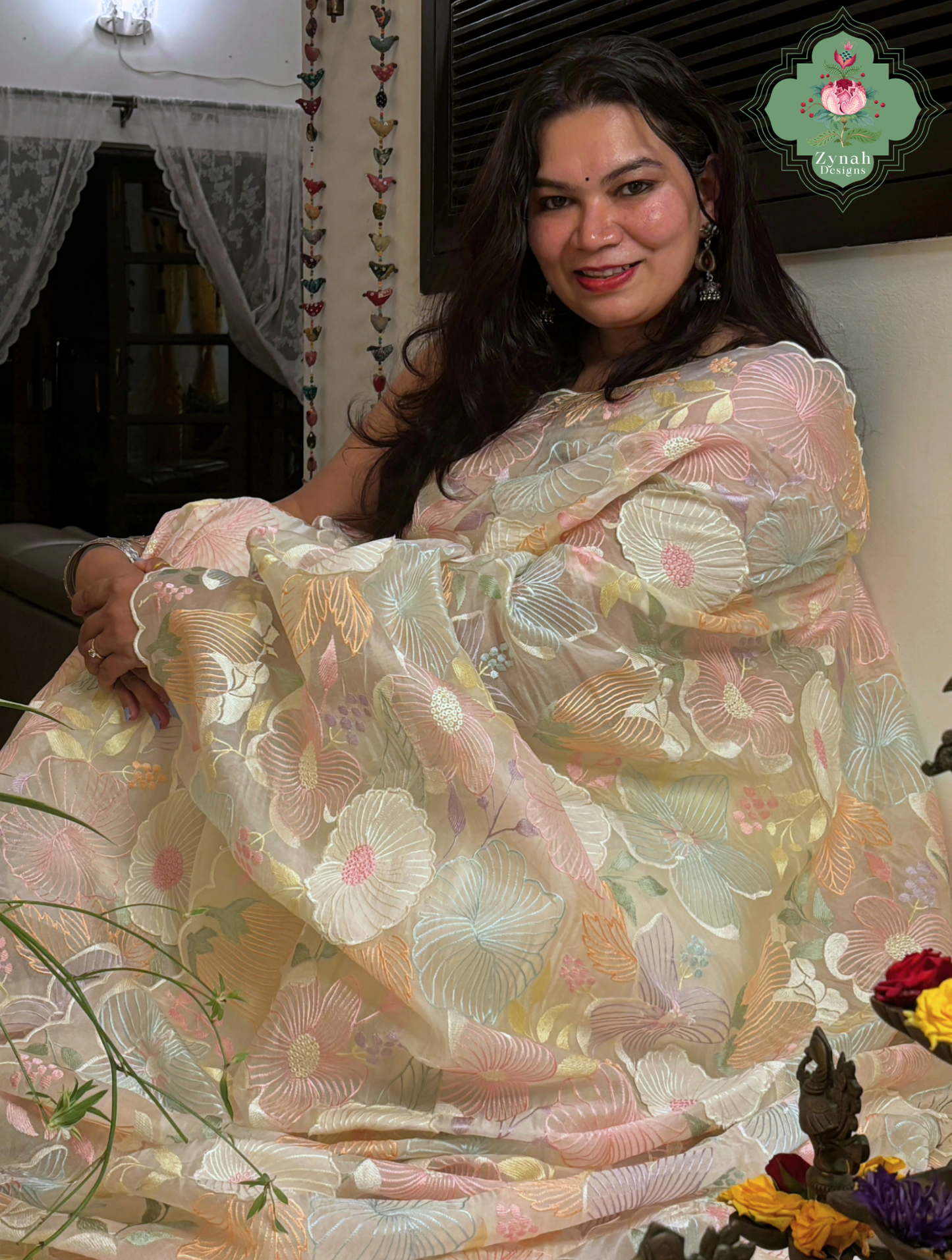 Malarika Off White Organza Silk Saree With Pastel Floral Embroidery & Patchwork