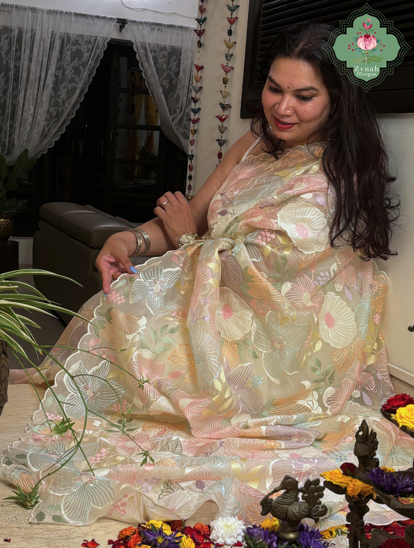 Malarika Off White Organza Silk Saree With Pastel Floral Embroidery & Patchwork