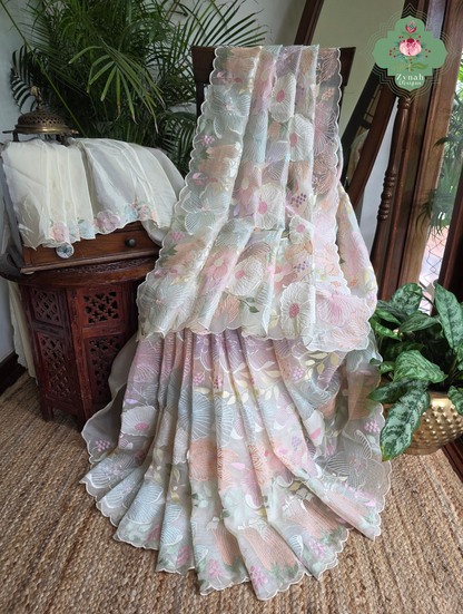 Malarika Off White Organza Silk Saree With Pastel Floral Embroidery & Patchwork