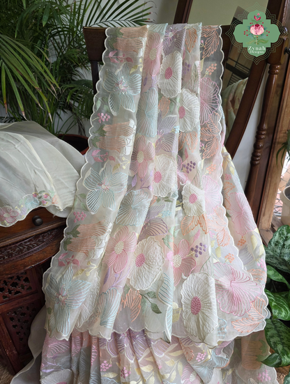 Malarika Off White Organza Silk Saree With Pastel Floral Embroidery & Patchwork