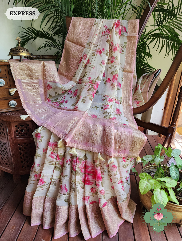 Peach Organza Satin Silk Saree: A harmonious blend of elegance with Zari embellishments and enchanting English Garden print.