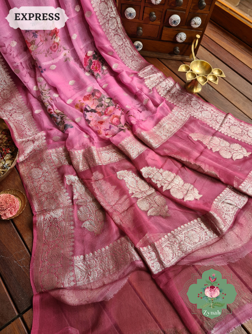 Pink Khaddi Georgette Floral Banarasi Saree w/ Silver Zari. Perfect for any occasion. Must-have for fashion-forward women.