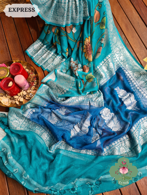 Turquoise Khaddi Georgette Floral Banarasi Saree w/ Silver Zari. Radiates elegance & grace. Perfect for special occasions.