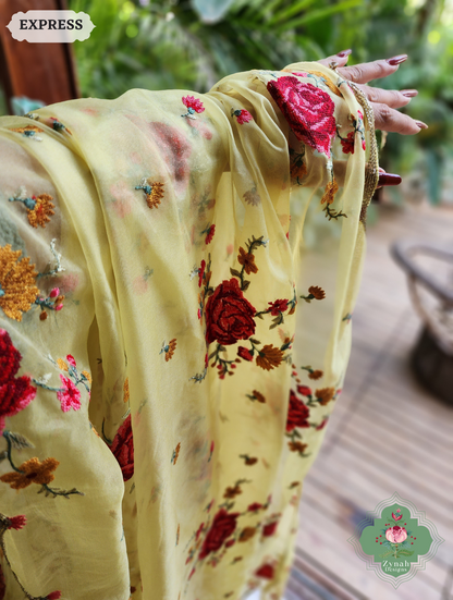 Zynah Yellow Organza Silk Saree Featuring Cross-Stitch Embroidered Roses & Scalloped Border Hand Embellished With Cutdana; Custom Stitched/Ready-made Blouse, Fall, Petticoat; SKU: 1112202401