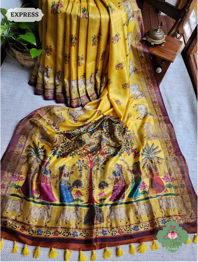 Graceful yellow pure tussar silk saree with intricate pichwai print. Soft, lightweight, and perfect for special occasions.