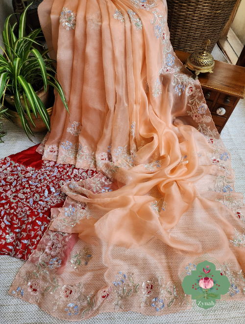 Peach Organza Silk Saree with Cutdana & Sequins Handwork - Elegant and Charming attire for any event.
