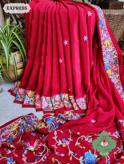 Red Pure Crepe Silk saree with intricate hand-embroidered Parsi Gara work in floral motifs. Perfect for special ocassion.