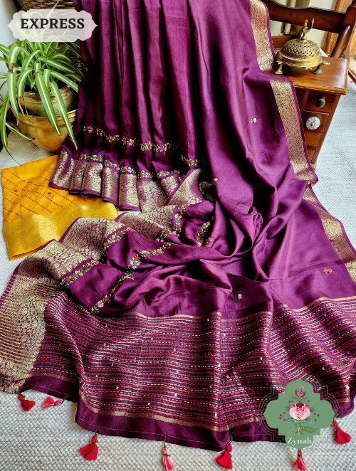 Zynah Wine Munga Silk Saree with Zari Borders, Frenchknot & Kantha Embroidery, and hand-embroidered vine.
